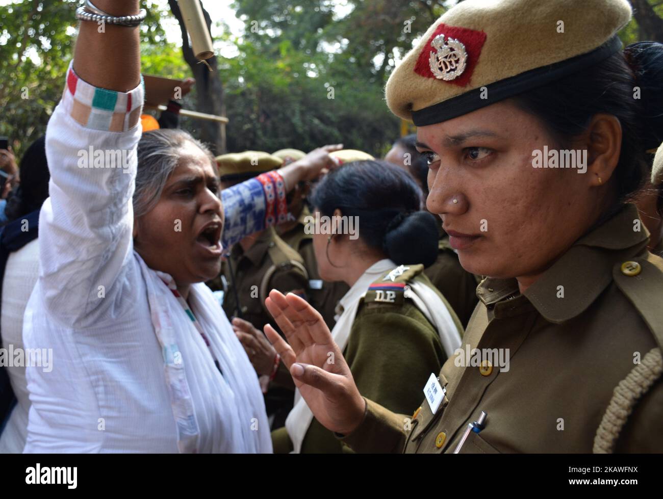 A protestor is stopped by Delhi police constables as she marches towards Delhi police barracades demanding justice for victims in the 1984 Anti-Sikh riots and arrest of Congress leader Jadgish Tytler for his alleged involvement in the 1984 anti-Sikh riots in New Delhi on 9th February, 2018. (Photo by Sahiba Chawdhary/NurPhoto) Stock Photo