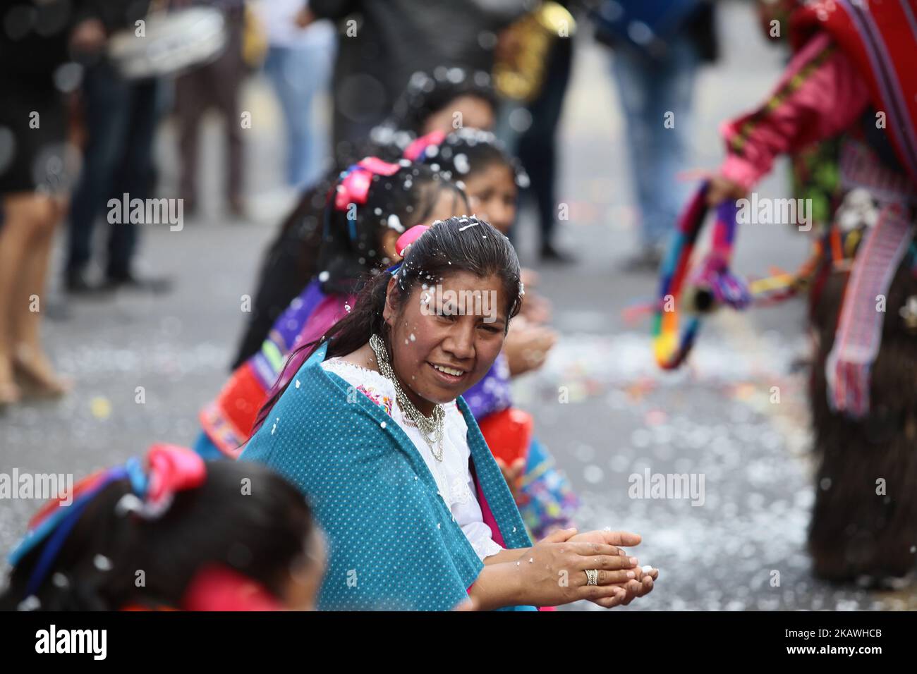 In Ecuador, the Carnival is not only celebrated with dancing, foam, water and parades. This traditional celebration has its religious tinge with the popular Mass of the 'Carnival Child'. The custom dictates that every year a prioste is chosen, who is the person in charge of offering the party in honor of the 'Divine child', which begins with a mass. In the Santa Rita neighborhood, in the south of Quito, this year the honor of giving the party fell on Daysi Tito. The young woman prepared a whole year to organize the celebration, which includes comparsas parading through the main streets of the  Stock Photo