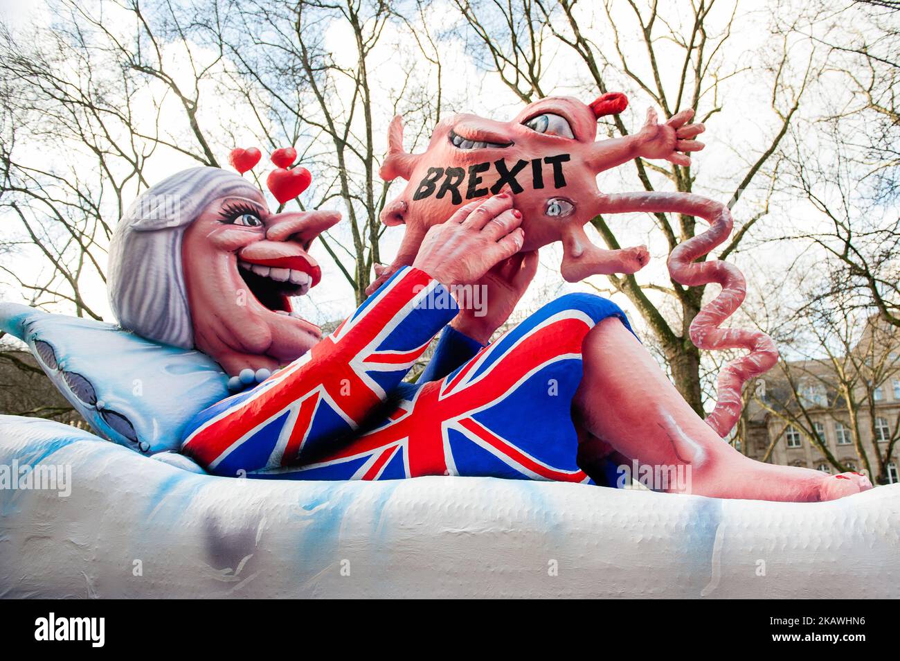 A float featuring Prime Minister Theresa May is seen during the annual Rose Monday parade on February 12, 2018 in Dusseldorf, Germany. Political satire is a traditional cornerstone of the annual parades. More than 30 music ensembles and 5,000 participants join the procession through the city. Elaborately built and decorated floats address cultural and political issues and can be satirical, hilarious and even controversial. The politically themed floats of satirist Jacques Tilly are famous the world over. (Photo by Romy Arroyo Fernandez/NurPhoto) Stock Photo