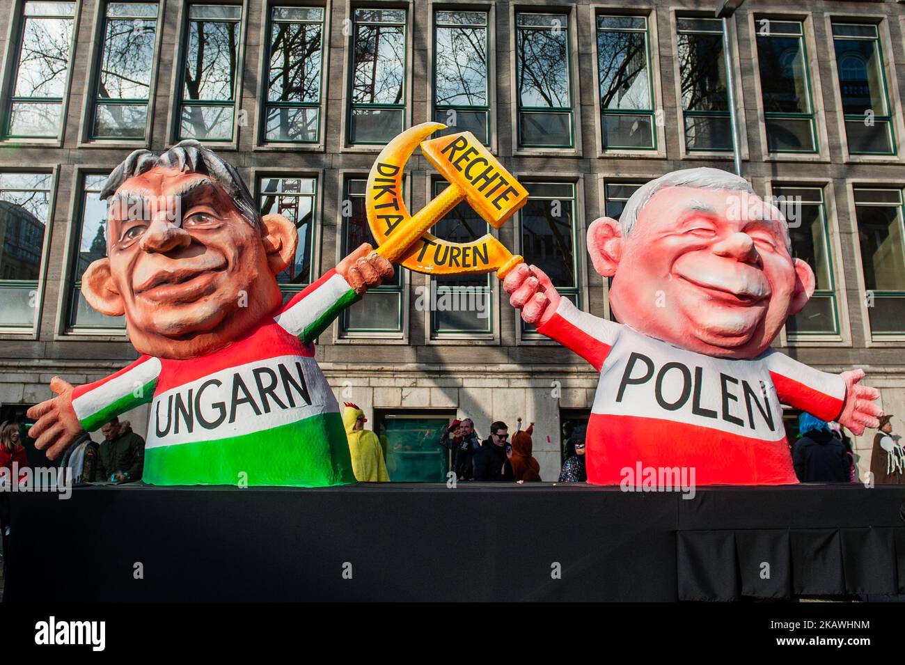 A float featuring Prime Minister of Hungary Viktor Orban (L) and leader of Poland, Jaroslaw Kaczynski (R), is seen prior to the annual Rose Monday parade on February 12, 2018 in Dusseldorf, Germany. Political satire is a traditional cornerstone of the annual parades. More than 30 music ensembles and 5,000 participants join the procession through the city. Elaborately built and decorated floats address cultural and political issues and can be satirical, hilarious and even controversial. The politically themed floats of satirist Jacques Tilly are famous the world over. (Photo by Romy Arroyo Fern Stock Photo