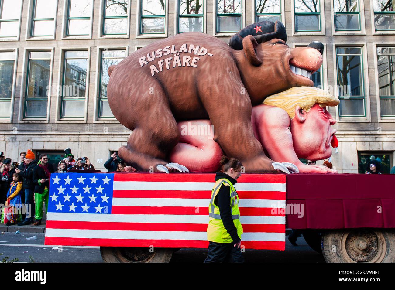 A float featuring US President Donald Trump and a russian bear is seen during the annual Rose Monday parade on February 12, 2018 in Dusseldorf, Germany. Political satire is a traditional cornerstone of the annual parades. More than 30 music ensembles and 5,000 participants join the procession through the city. Elaborately built and decorated floats address cultural and political issues and can be satirical, hilarious and even controversial. The politically themed floats of satirist Jacques Tilly are famous the world over. (Photo by Romy Arroyo Fernandez/NurPhoto) Stock Photo