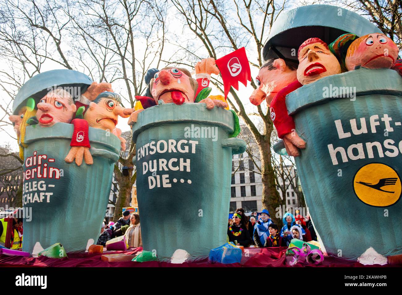 A float featuring the situation between Air Berlin and Lufthansa is seen during the annual Rose Monday parade on February 12, 2018 in Dusseldorf, Germany. Lufthansa took over a large portion of Air Berlin's former routes and planes following Air Berlin's bankruptcy. Political satire is a traditional cornerstone of the annual parades. More than 30 music ensembles and 5,000 participants join the procession through the city. Elaborately built and decorated floats address cultural and political issues and can be satirical, hilarious and even controversial. The politically themed floats of satirist Stock Photo
