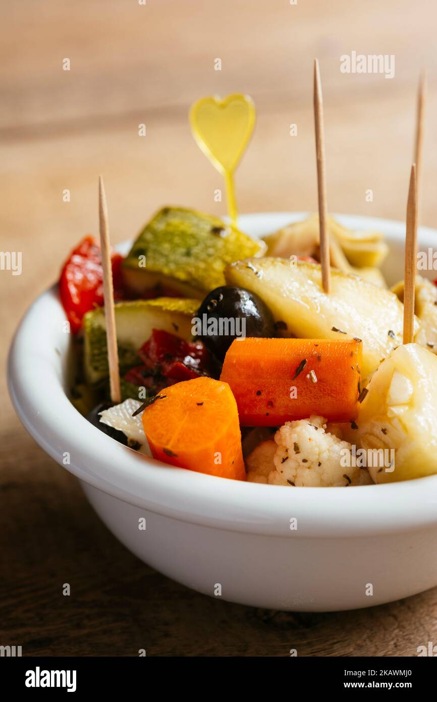 Bowl with a variety of marinated summer vegetables. Stock Photo