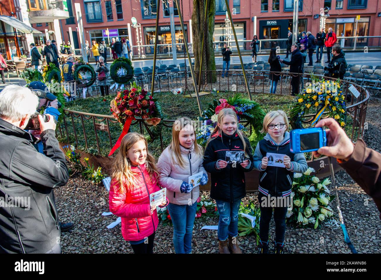 Children from the Montessori school with photos of the children victims during the annual commemoration of the bombing in Nijmegen, Netherlands, on 22 February 2018. he Bombing of Nijmegen was an unplanned bombing attack by American aircraft on the city of Nijmegen in the Netherlands on 22 February 1944. During this Allied mistake bombing, almost 800 people were killed and a large part of the city center of Nijmegen was destroyed. Every February 22nd an official commemoration has take place at the Raadhuishof, the location where the Montessori school was located, where 24 children and 8 sister Stock Photo
