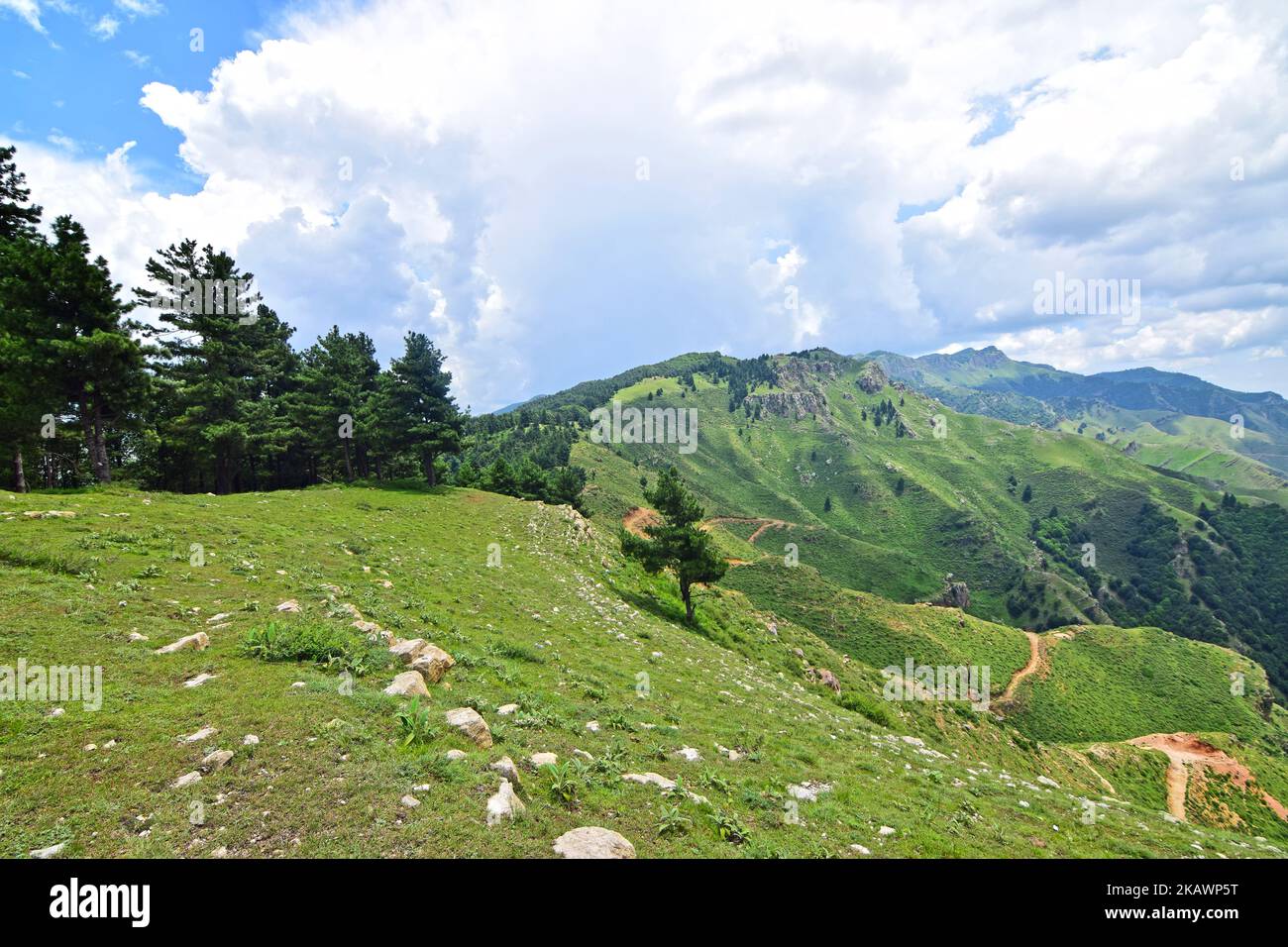 An aerial of beautiful green mountains under a blue cloudy sk Stock ...