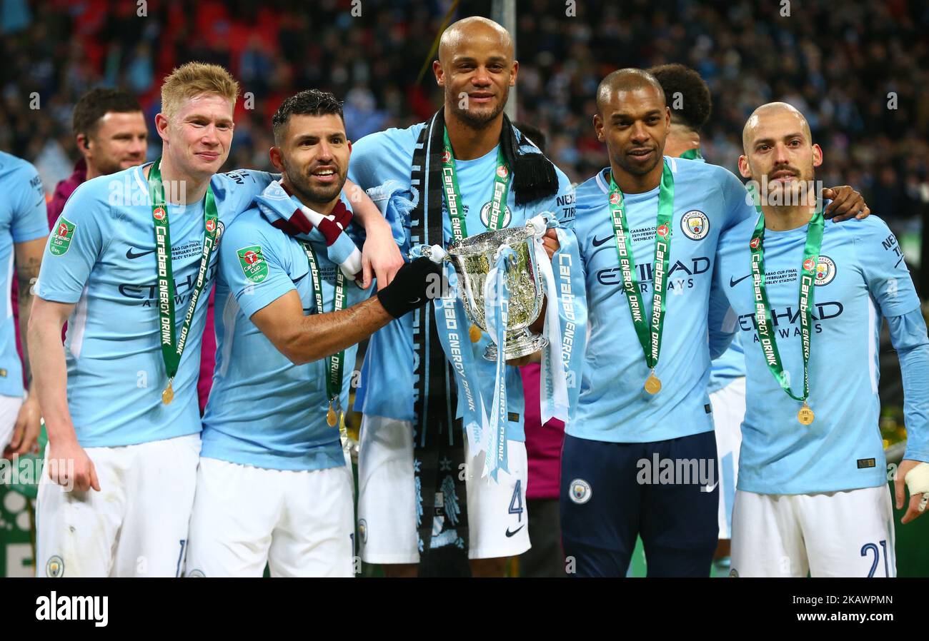 L-R Manchester City's Kevin De Bruyne Manchester City's Sergio Aguero Manchester City's Vincent Kompany Manchester City's Fernandinho and Manchester City's David Silva with Trophy during Carabao Cup Final match between Arsenal against Manchester City at Wembley stadium, London England on 25 Feb 2018 (Photo by Kieran Galvin/NurPhoto)  Stock Photo