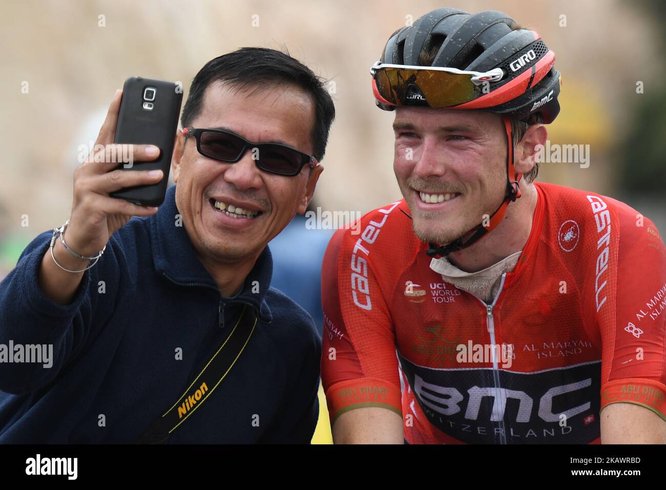 Australia's Rohan Dennis from BMC Racing Team posses for a selfie with a fan at the finish line of the fifth and final stage of the 2018 Abu Dhabi Tour. On Sunday, February 25, 2018, in Qasr Al Muwaiji, Abu Dhabi, United Arab Emirates. (Photo by Artur Widak/NurPhoto)  Stock Photo