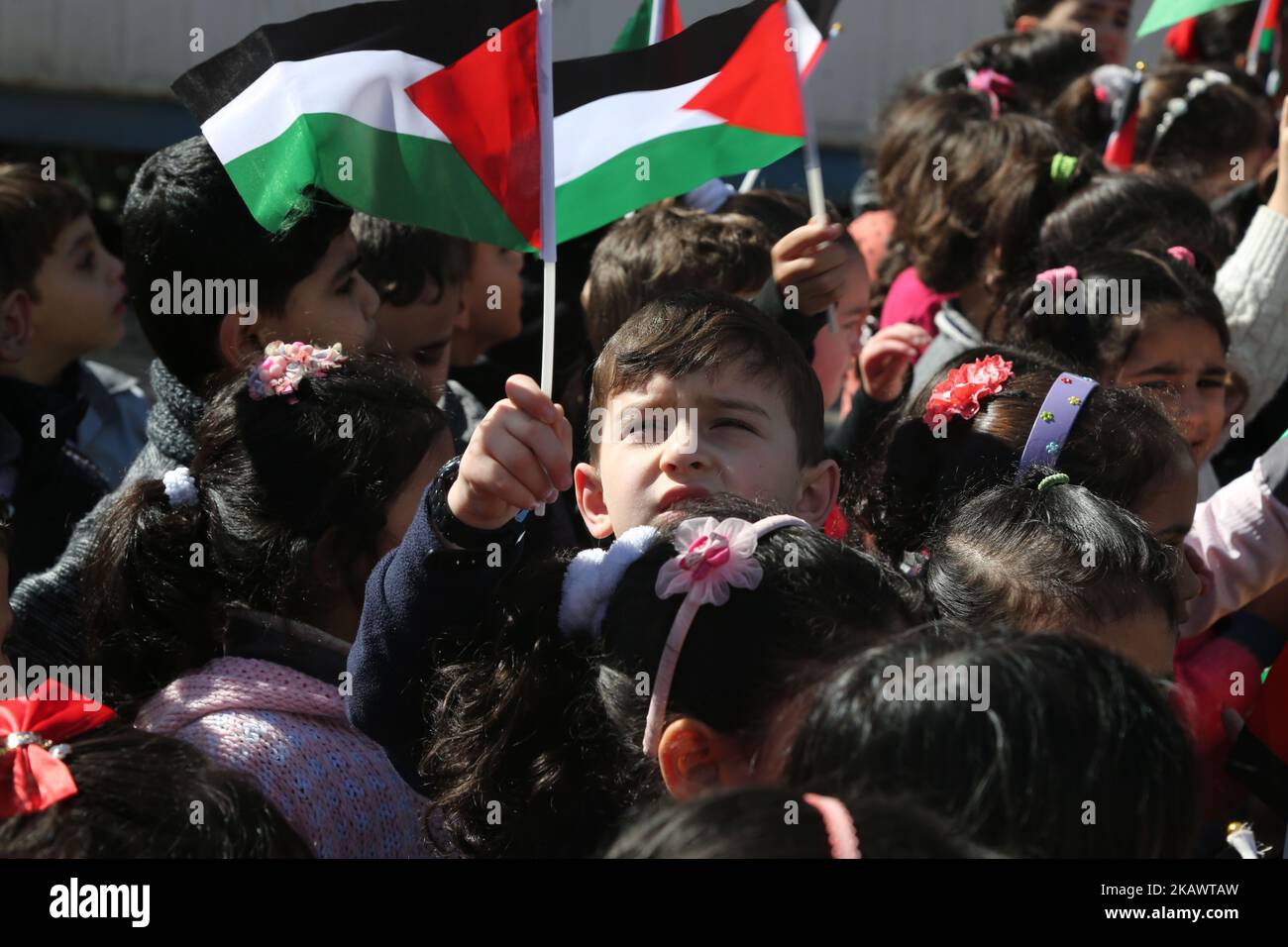 Palestinian children hold banners during a protest against U.S. President Donald Trump's decision to recognise Jerusalem as the capital of Israel, in front of the high commissioner for human rights headquarters, in Gaza city on February 28, 2018. (Photo by Majdi Fathi/NurPhoto) Stock Photo