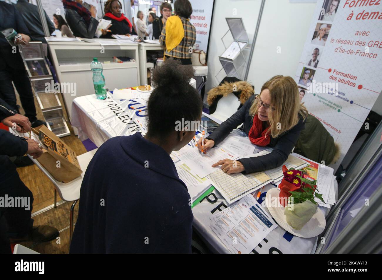 Jobseeker talks with a member of recruitment service at the "Paris pour l