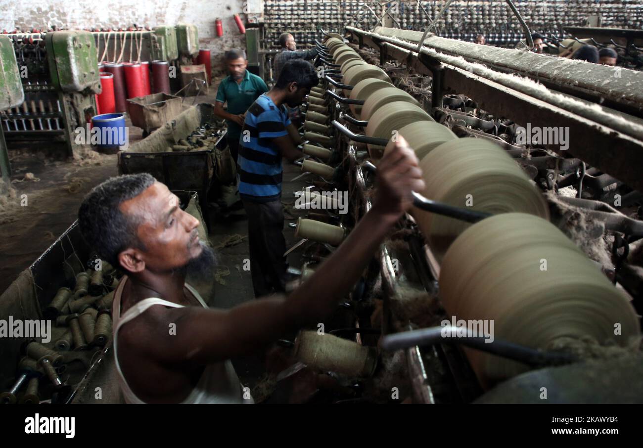 Workers busy in making jute sacks at Latif Bawany Jute Mills in Demra