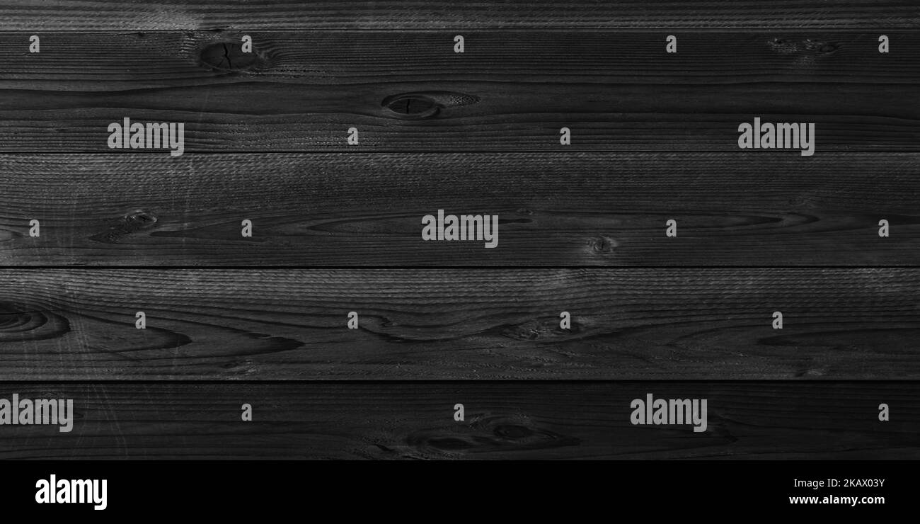 An old black anthracite grey rustic dark wooden boards texture wood