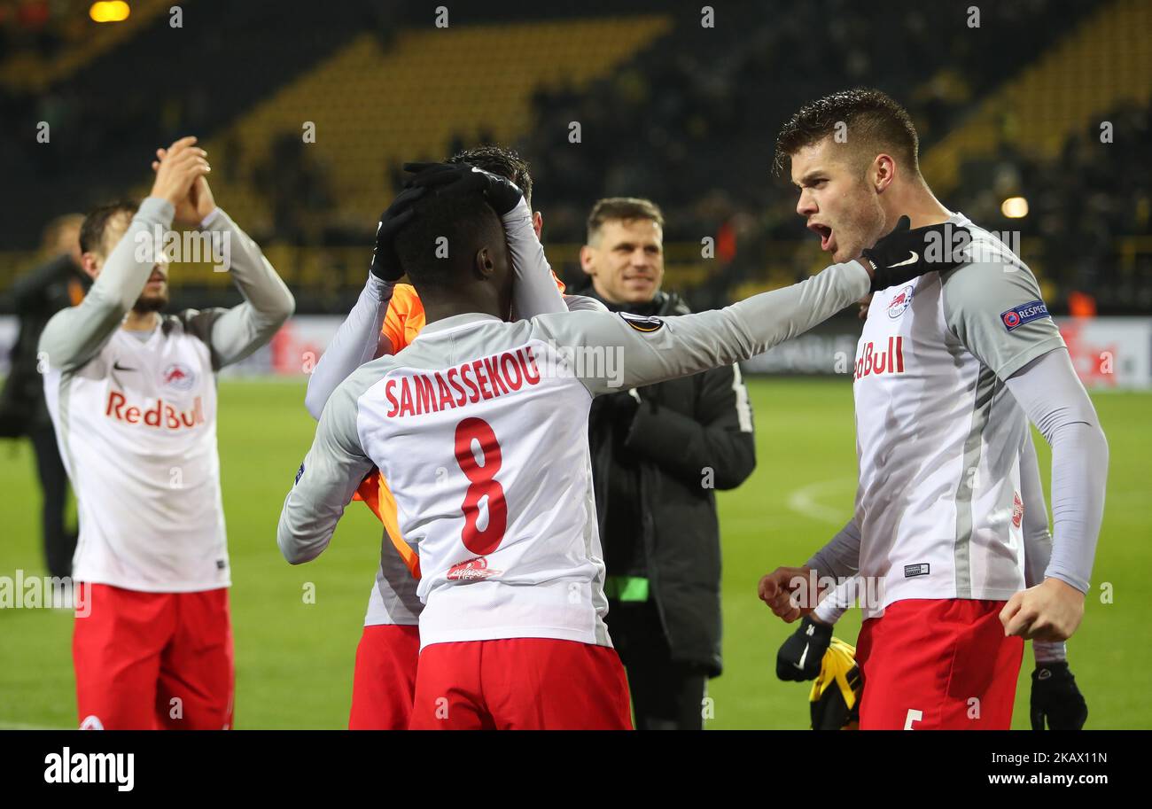 Diadie Samassekou and Duje Caleta-Car (R) of Red Bull Salzburg celebrate victory after the UEFA Europa League Round of 16 match between Borussia Dortmund and FC Red Bull Salzburg at the Signal Iduna Park on March 8, 2018 in Dortmund, Germany. (Photo by Raddad Jebarah/NurPhoto) Stock Photo