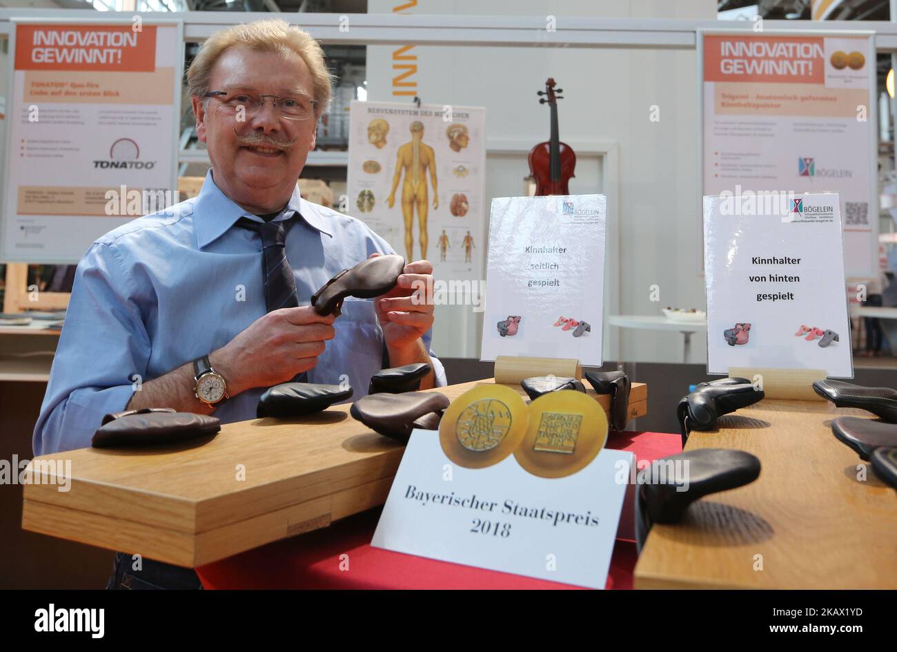 The inventor Josef Bögelein sen. presents his special chin rests for