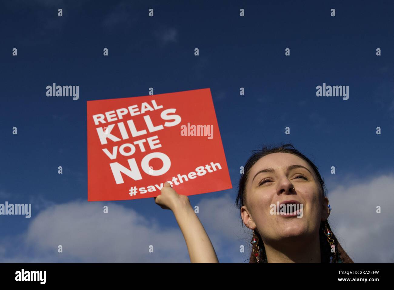 Protesters hold an anti-abortion placards during the All-Ireland Rally for Life (Save the 8th) - march to Save the 8th amendment to the Irish constitution which protects their right to life, and bans abortion. On Saturday, March 10, 2017, Dublin, Ireland. The Irish government has confirmed that it will hold a referendum on reform of the country’s strict anti-abortion laws by the end of May. Article 40.3.3 – known as the eighth amendment of the Constitution of Ireland recognizes the equal right to life of the mother and the unborn child. If the vote is in favour of repeal, the government is ex Stock Photo