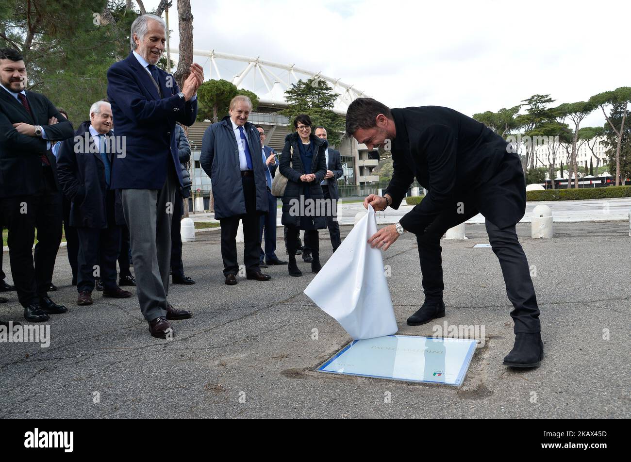 The president of the Italian Olympic Committee (CONI), Giovanni Malago (L) and former player Paolo Maldini (R) during the ceremony Walk of Fame in Rome, Italy, on 12 March 2018. The Walk of Fame is enriched with 5 more samples. Along the Via Olimpiadi, which leads straight to the Olympic stadium in Rome, new plates have been added dedicated to five blue champions no longer in business: the historic Milan captain and national defender, soccer player Paolo Maldini, the swimmer Massimiliano Rosolino, the middle distance runner Luigi Beccali, the cyclist Ercole Baldini and the volleyball player Sa Stock Photo
