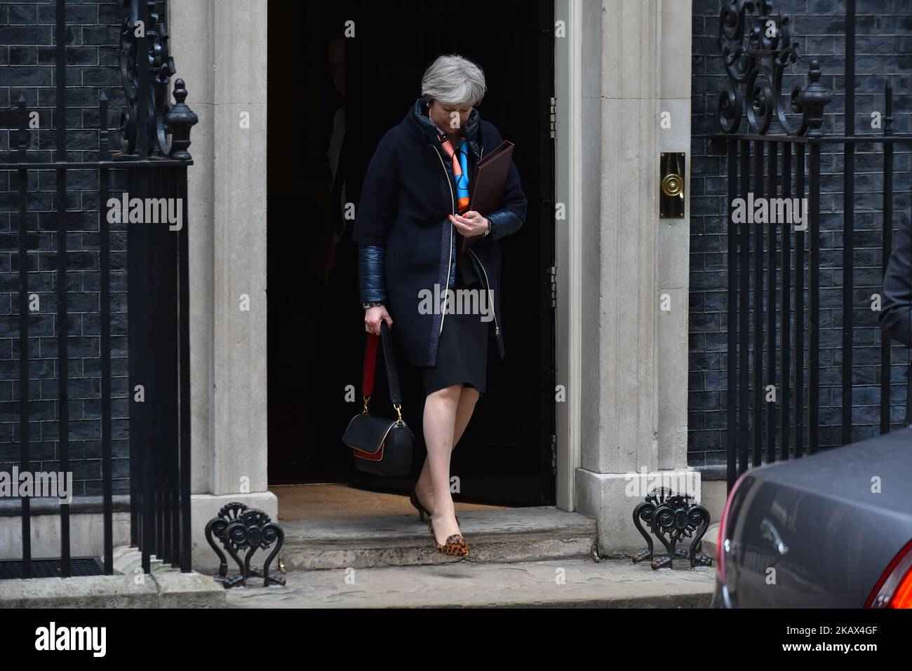 Prime Minister Theresa May leaves Downing Street after attending the weekly Cabinet meeting, London, UK on March 13, 2018. Prime Minister Theresa May and Chancellor of the Exchequer Philip Hammond headed to the Houses of Parliament as he gives Spring Budget update. (Photo by Alberto Pezzali/NurPhoto) Stock Photo