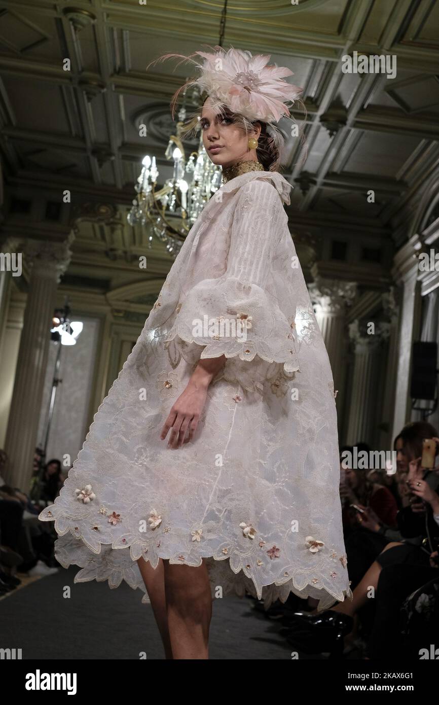 A Model shows a EMILIO SALINAS design during fashion week ATELIER COUTURE fashionable bridal and luxury in ceremony at the Fernan Nunez Palace in Madrid March 15, 2018 (Photo by Oscar Gonzalez/NurPhoto) Stock Photo