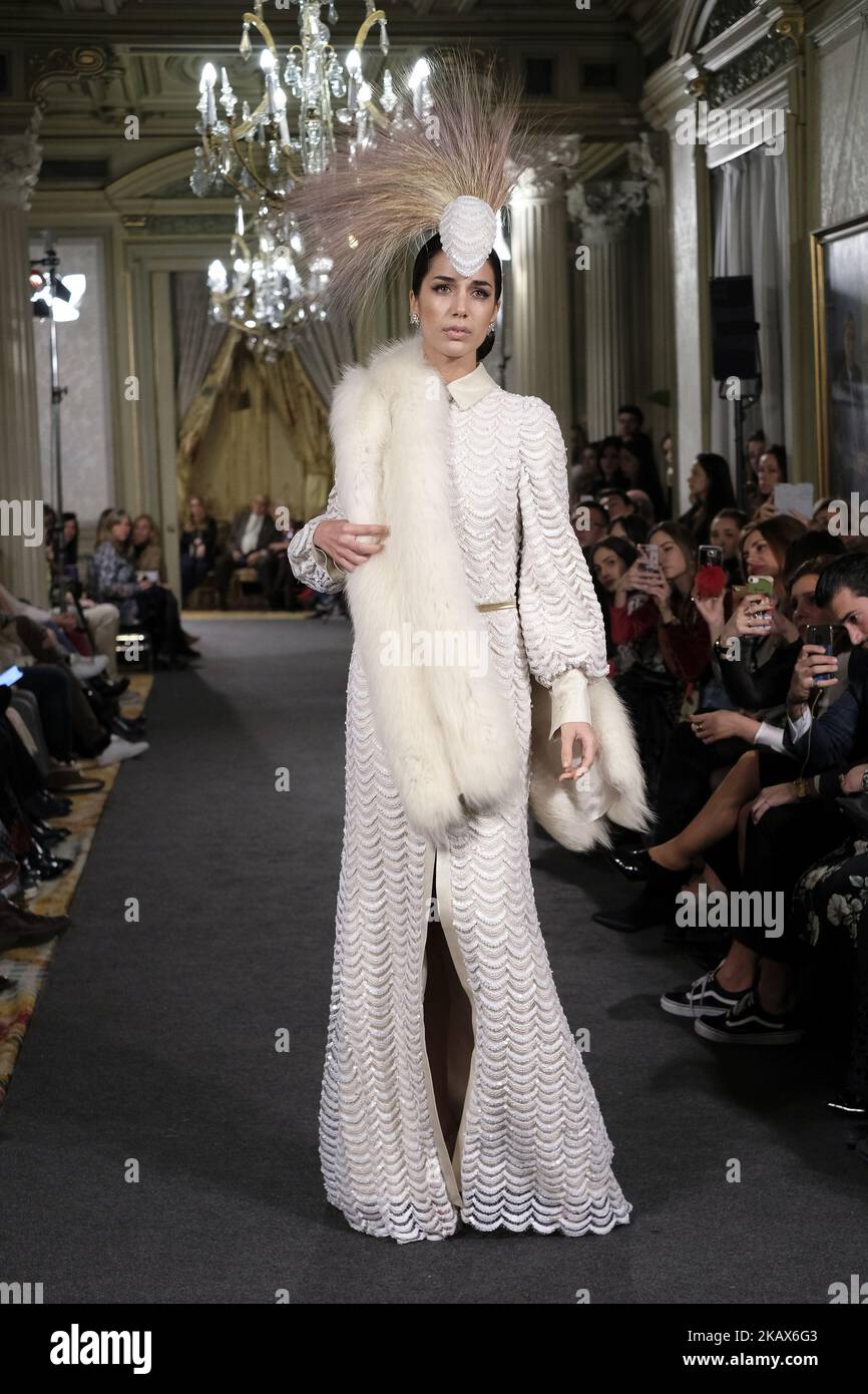 A Model shows a EMILIO SALINAS design during fashion week ATELIER COUTURE fashionable bridal and luxury in ceremony at the Fernan Nunez Palace in Madrid March 15, 2018 (Photo by Oscar Gonzalez/NurPhoto) Stock Photo