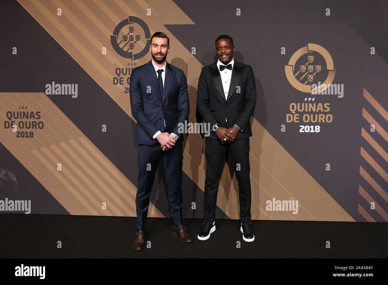 Portugals goalkeeper Rui Patricio (L) and Portugal's midfielder William Carvalho (R) poses on arrival at 'Quinas de Ouro' 2018 ceremony held and the Pavilhao Carlos Lopes in Lisbon, Portugal on March 19, 2018. (Photo by Bruno Barros / DPI / NurPhoto) Stock Photo