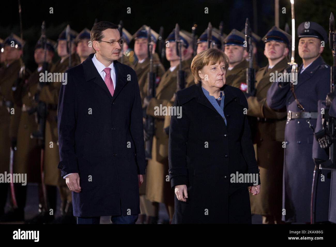 Polish Prime Minister Mateusz Morawiecki welcomes German Chancellor Angela Merkel before their meeting in Warsaw, Poland on March 19, 2018 (Photo by Mateusz Wlodarczyk/NurPhoto) Stock Photo