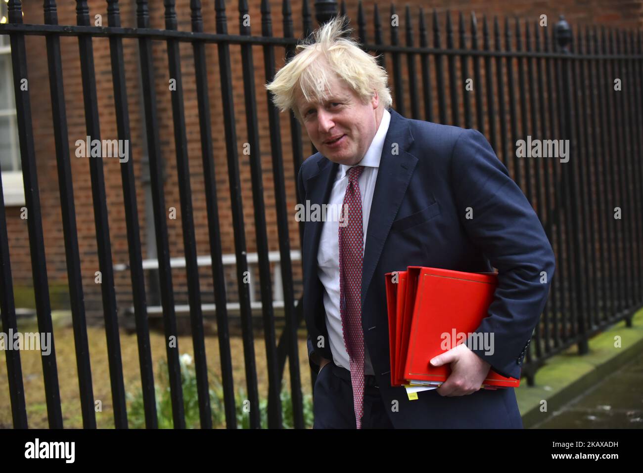 British Foreign Secretary Boris Johnson leaves 10 Downing Street after attending the weekly Cabinet Meeting, London on March 27, 2018. Prime Minister Theresa May is facing another Brexit hurdle after the opposition Labour Party announced its pushing for a legal commitment to avoid a hard border with Ireland after Britain leaves the European Union. The Migration Advisory Committee (MAC) said businesses are concerned about their ability to recruit workers from the EU after Britain leaves the EU. UK employers also see EU workers as 'more reliable' and eager than their British counterparts, the re Stock Photo
