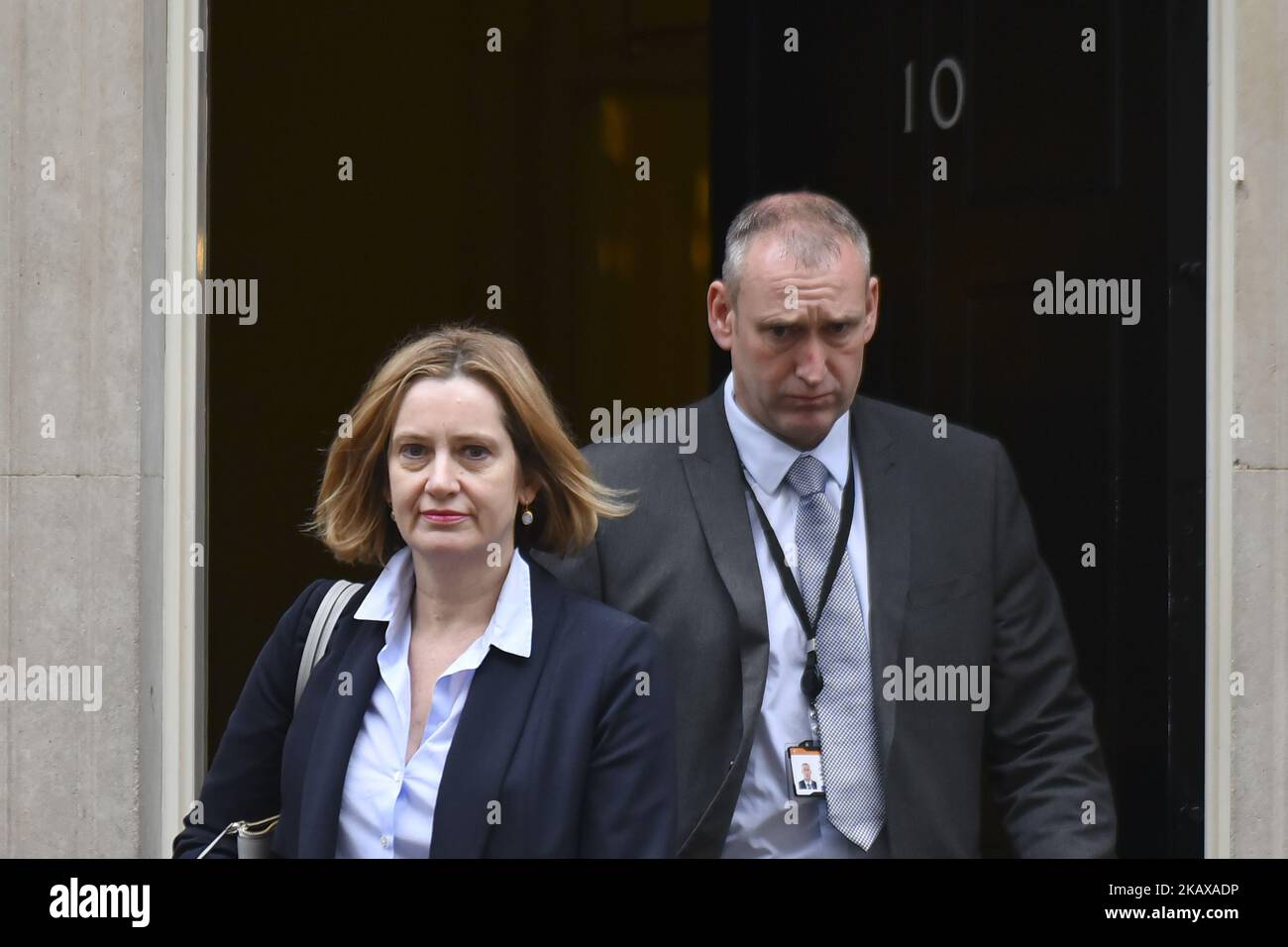 Britain's Home Secretary Amber Rudd leaves 10 Downing Street after attending the weekly Cabinet Meeting, London on March 27, 2018. Prime Minister Theresa May is facing another Brexit hurdle after the opposition Labour Party announced its pushing for a legal commitment to avoid a hard border with Ireland after Britain leaves the European Union. The Migration Advisory Committee (MAC) said businesses are concerned about their ability to recruit workers from the EU after Britain leaves the EU. UK employers also see EU workers as 'more reliable' and eager than their British counterparts, the report Stock Photo
