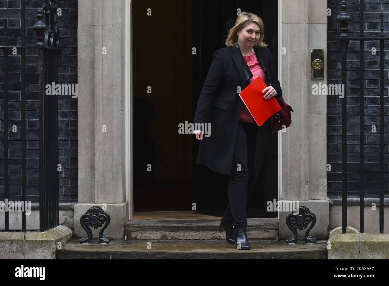 Secretary of State for Northern Ireland Karen Bradley leaves 10 Downing Street after attending the weekly Cabinet Meeting, London on March 27, 2018. Prime Minister Theresa May is facing another Brexit hurdle after the opposition Labour Party announced its pushing for a legal commitment to avoid a hard border with Ireland after Britain leaves the European Union. The Migration Advisory Committee (MAC) said businesses are concerned about their ability to recruit workers from the EU after Britain leaves the EU. UK employers also see EU workers as 'more reliable' and eager than their British counte Stock Photo