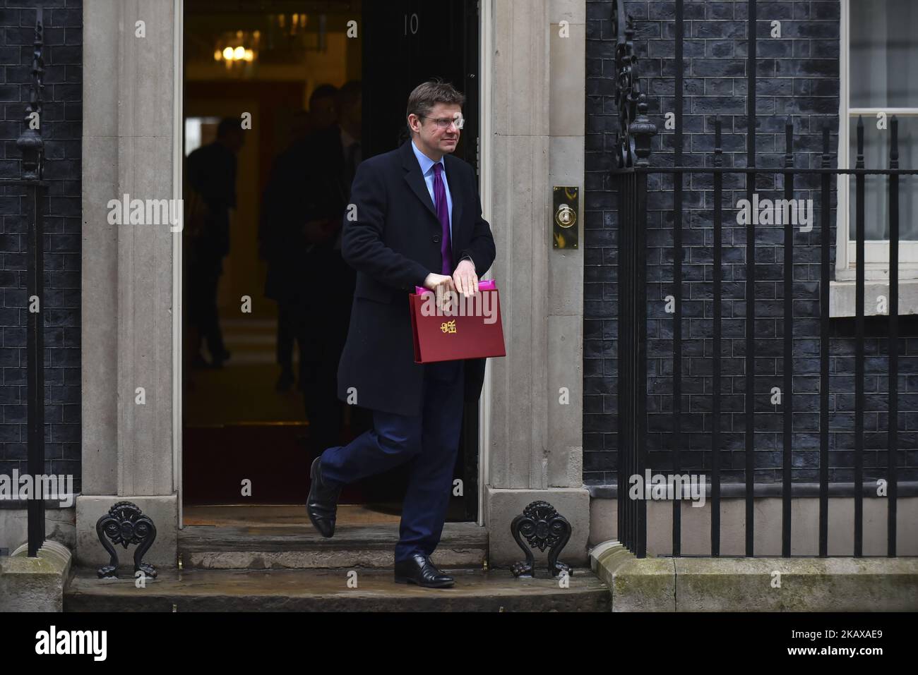Secretary of State for Business, Energy and Industrial Strategy Greg Clark leaves 10 Downing Street after attending the weekly Cabinet Meeting, London on March 27, 2018. Prime Minister Theresa May is facing another Brexit hurdle after the opposition Labour Party announced its pushing for a legal commitment to avoid a hard border with Ireland after Britain leaves the European Union. The Migration Advisory Committee (MAC) said businesses are concerned about their ability to recruit workers from the EU after Britain leaves the EU. UK employers also see EU workers as 'more reliable' and eager than Stock Photo