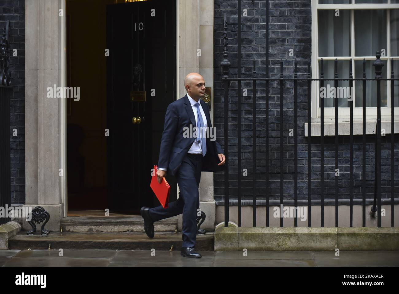 Britain's Secretary of State for Housing, Communities and Local Government Sajid Javid leaves 10 Downing Street after attending the weekly Cabinet Meeting, London on March 27, 2018. Prime Minister Theresa May is facing another Brexit hurdle after the opposition Labour Party announced its pushing for a legal commitment to avoid a hard border with Ireland after Britain leaves the European Union. The Migration Advisory Committee (MAC) said businesses are concerned about their ability to recruit workers from the EU after Britain leaves the EU. UK employers also see EU workers as 'more reliable' an Stock Photo