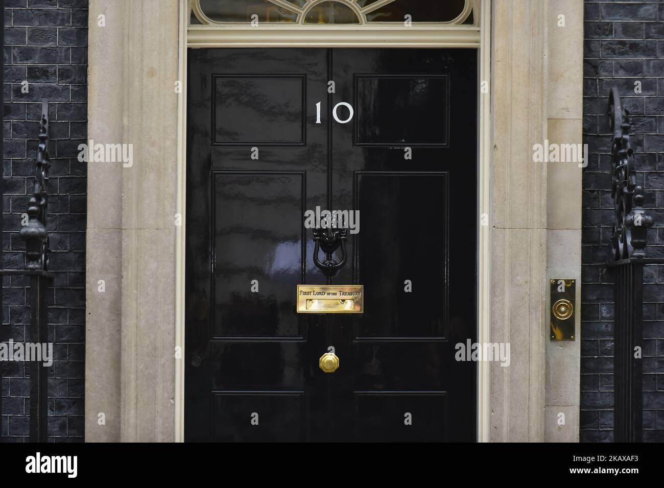 10 Downing Street door is pictured in London on March 27, 2018. Prime Minister Theresa May is facing another Brexit hurdle after the opposition Labour Party announced its pushing for a legal commitment to avoid a hard border with Ireland after Britain leaves the European Union. The Migration Advisory Committee (MAC) said businesses are concerned about their ability to recruit workers from the EU after Britain leaves the EU. UK employers also see EU workers as 'more reliable' and eager than their British counterparts, the report said. (Photo by Alberto Pezzali/NurPhoto) Stock Photo