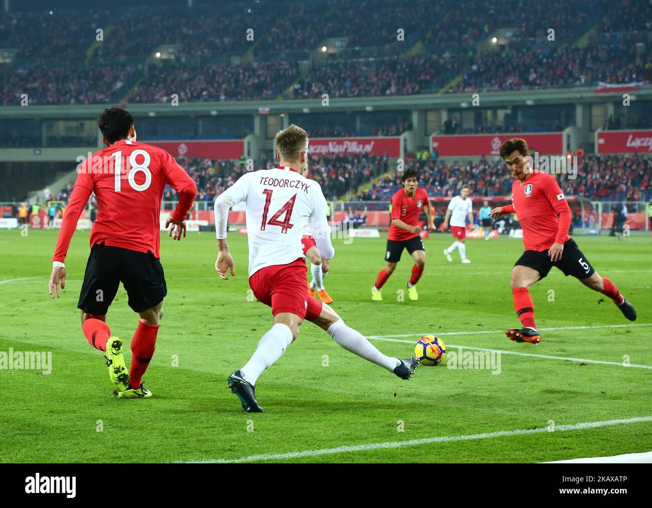 Lukasz Teodorczyk and Yun Young-sun during the international friendly soccer match between Poland and South Korea national football teams, at the Silesian Stadium in Chorzow, Poland on 27 March 2018 (Photo by Mateusz Wlodarczyk/NurPhoto) Stock Photo