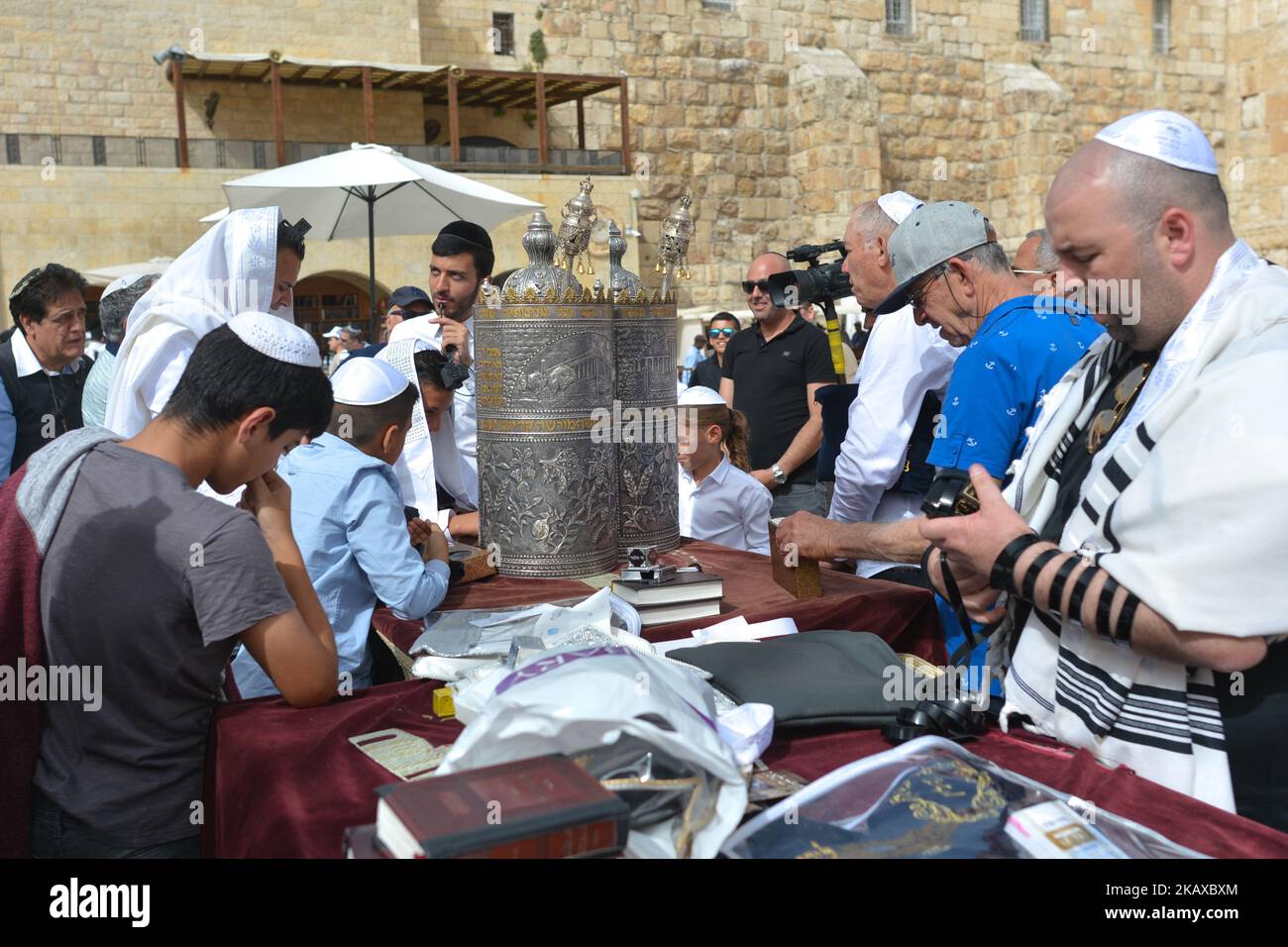Young boys seen at The Western Wall on their Bar Mitzvah day, a Jewish coming of age ritual for boys, in the Old City in Jerusalem. Wednesday, 14 March 2018, in Jerusalem, Israel. (Photo by Artur Widak/NurPhoto)  Stock Photo