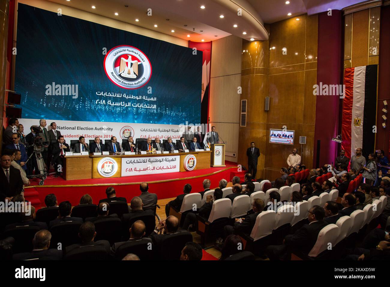 National Elections Authority (NEC) chief Lasheen Ibrahim (C) and Deputy Chief of the NEC Mahmoud al-Sherif (C-L) stand for the national anthem during a press conference in Cairo on April 2, 2018, to announce official result of Egypt presidential election. Egypt's election commission says President Abdel-Fattah el-Sissi has won a second, four-year term with 97 percent of the vote in last week's election, with turnout of 41.5 percent. (Photo by Fayed El-Geziry/NurPhoto) Stock Photo