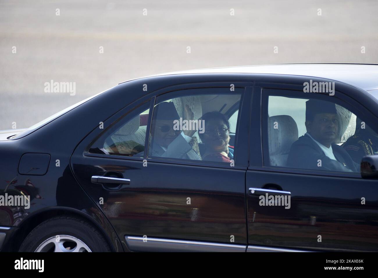 Prime Minister KP Sharma Oli wave his hand along with his wife Radhika ...