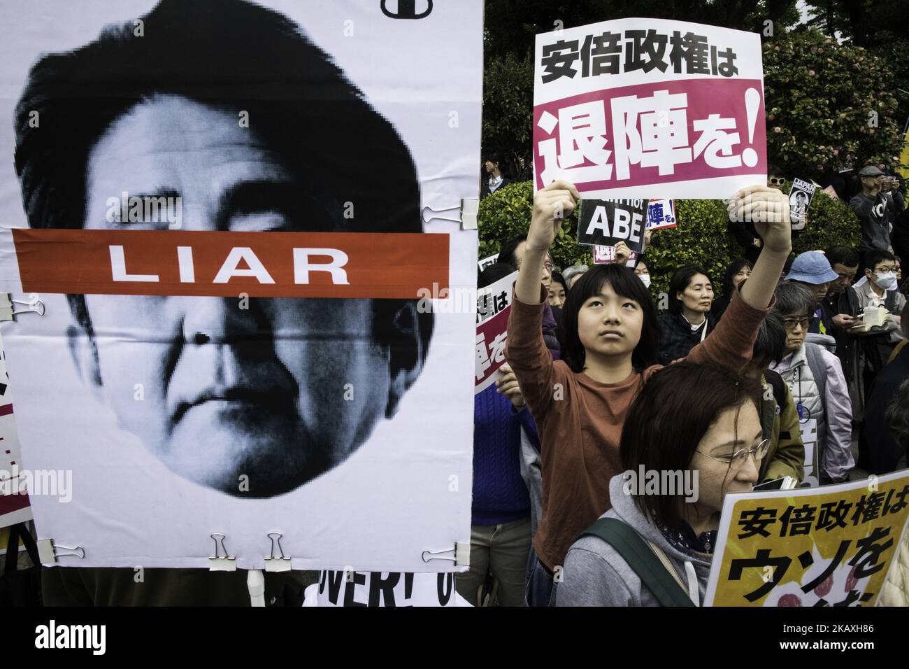 Protester holds a placard during a demonstration against Japan's Prime Minister Shinzo Abe after allegations of corruption, calling him to resign, on April 14, 2018 in front of Tokyo parliament in Tokyo, Japan.(Photo by Richard Atrero de Guzman/NurPhoto) Stock Photo
