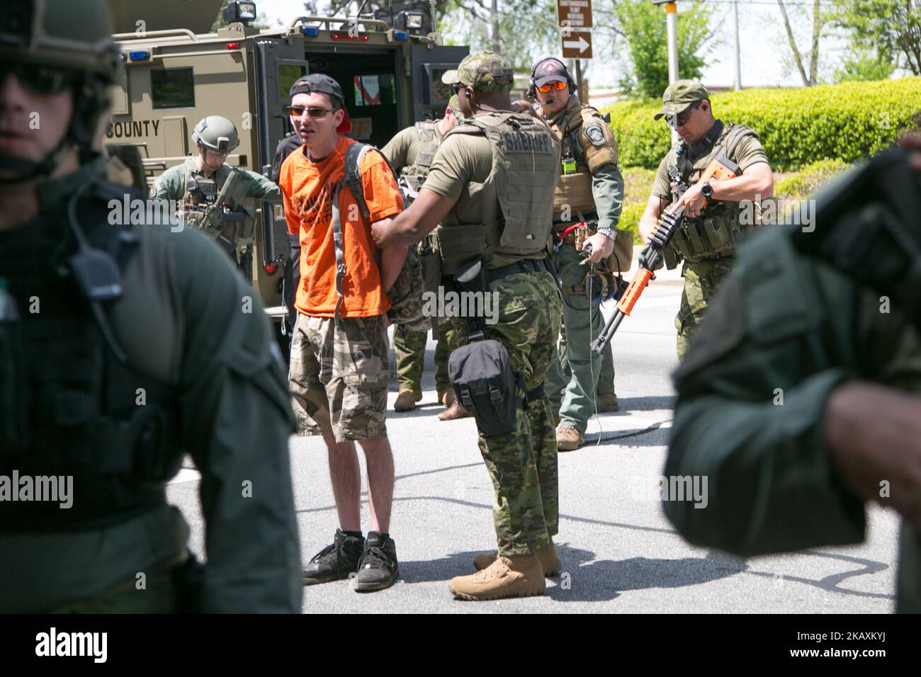 A protester is arrested before a National Socialist Movement rally at Greenville Street Park in Newnan, Georgia, USA on April 21, 2018. (Photo by Emily Molli/NurPhoto) Stock Photo
