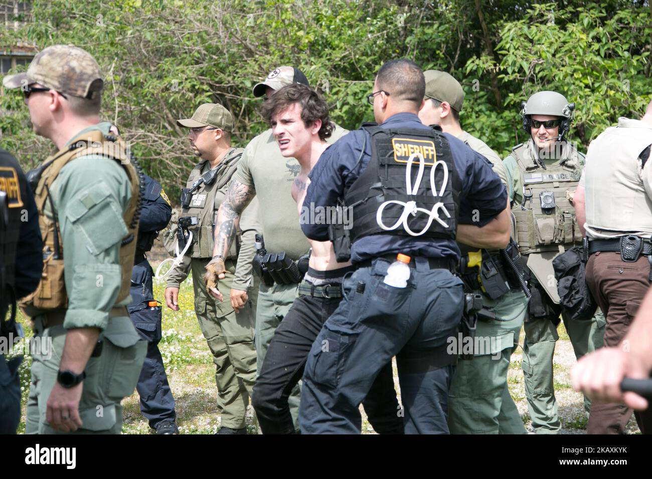 A protester is arrested during a National Socialist Movement rally at Greenville Street Park in Newnan, Georgia, USA on April 21, 2018. (Photo by Emily Molli/NurPhoto) Stock Photo