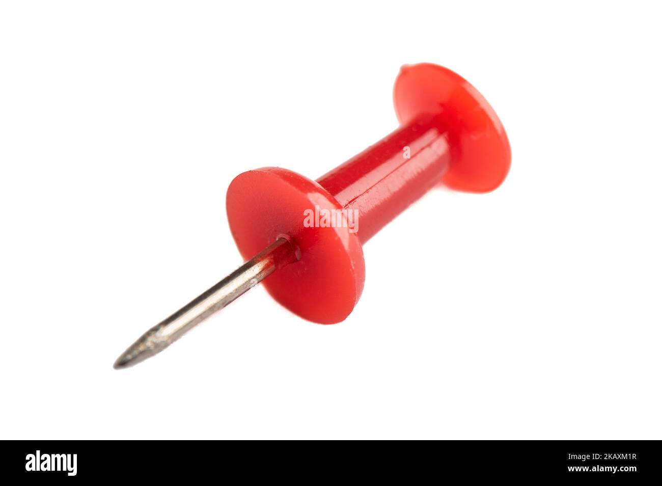 Macro shot of a red pushpin isolated on a white background. Stationery ...