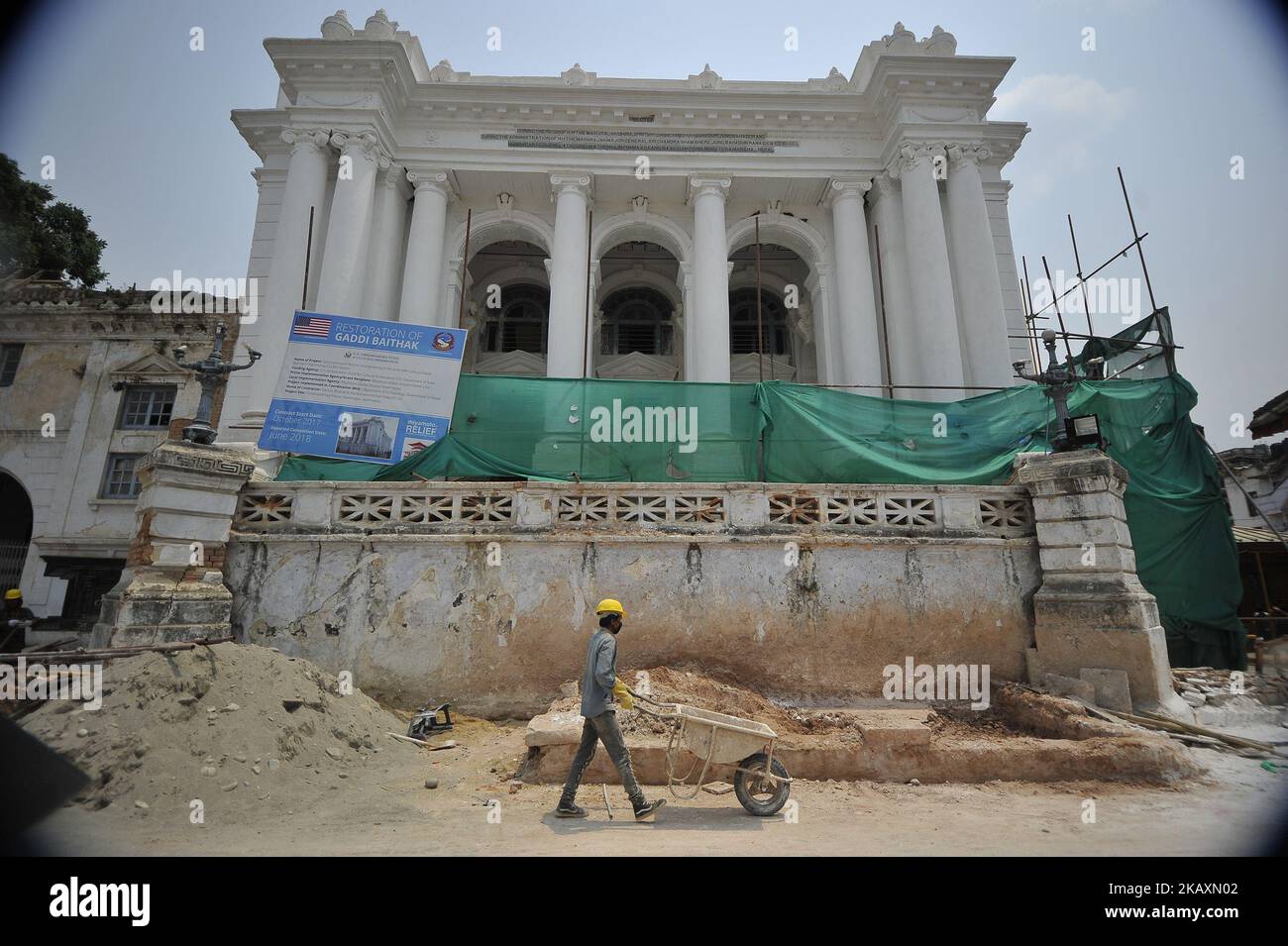 Nepalese people working on the Restoration of Gaddi Baithak, which was destructed on April 25, 2015 Gorkha Earthquake remembered during third anniversary in Kathmandu, Nepal on Wednesday, April 25, 2018. Most of the centuries-old monuments and houses were completely or partially destroyed in the catastrophic 7.8 magnitude earthquake that killed over 9,000 people, leaving thousands injured. (Photo by Narayan Maharjan/NurPhoto) Stock Photo