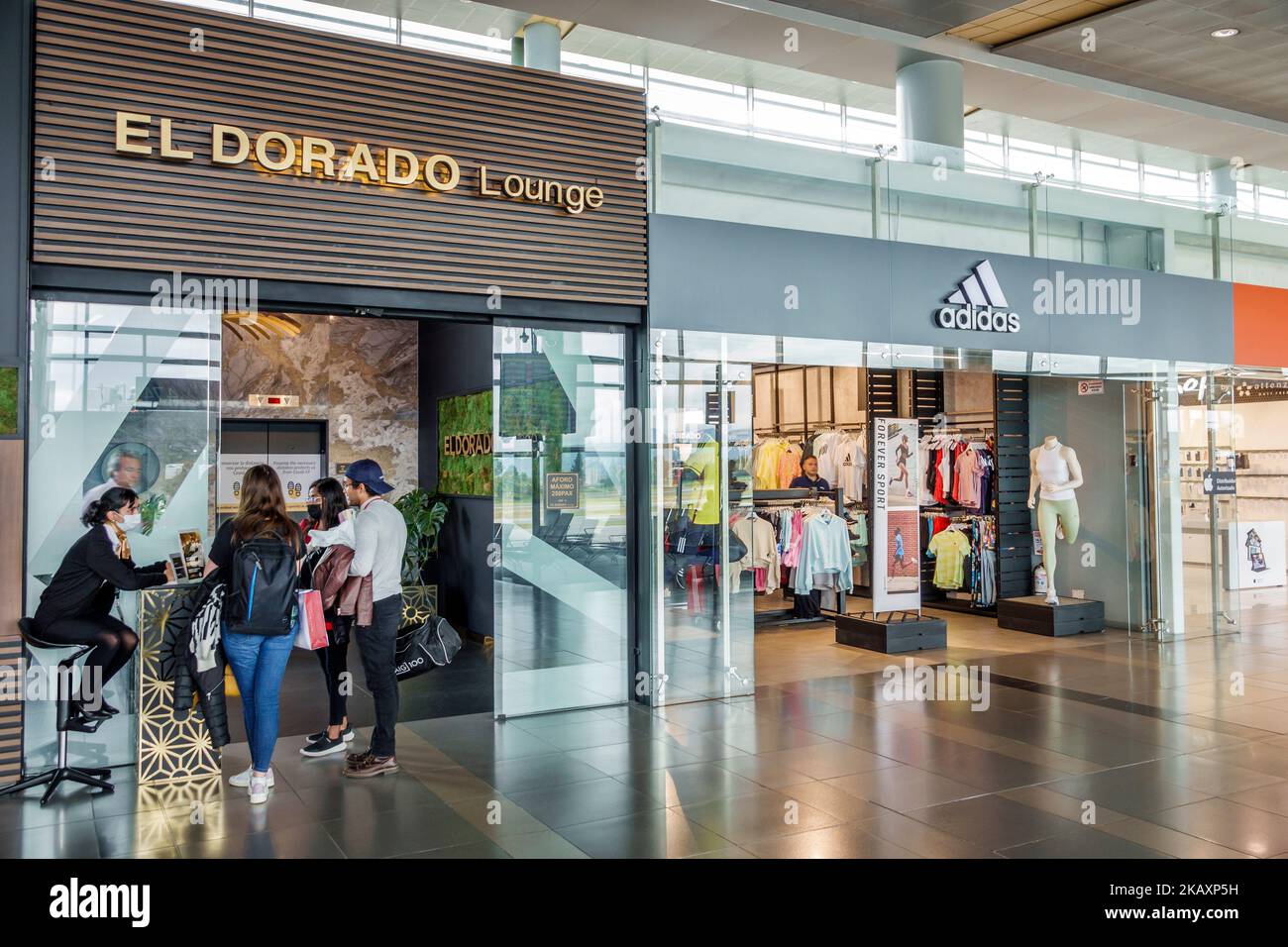 Bogota Colombia,El Dorado International Airport Aeropuerto Internacional El Dorado terminal concourse gate area inside interior,lounge Adidas sportwea Stock Photo