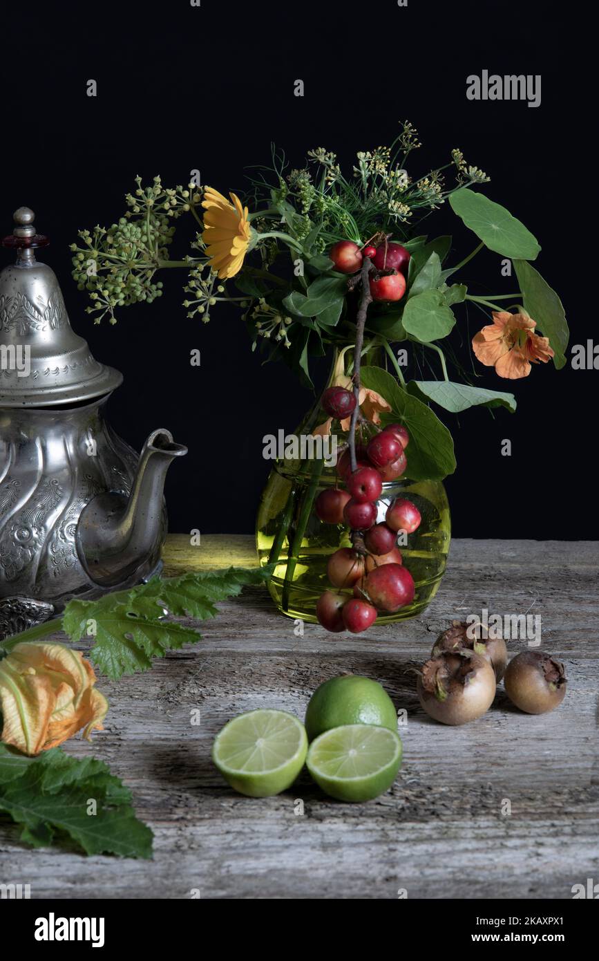 Still Life image of flowers and fruits in a vase Stock Photo - Alamy