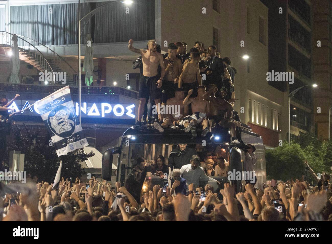 PAOK FC, the football team based in Thessaloniki, Greece, won on May 12, 2018 in Athens, inside the Olympic stadium playing with opponent team AEK. There have been some incidents during, before and after the game. In Thessaloniki everything was powerful. People welcomed the team on the bus with the cup in front of the city's landmark, The White Tower. Among the people was Ivan Savvidis, a Russian businessman who is forbidden to enter for 2 years in the greek stadiums. (Photo by Nicolas Economou/NurPhoto) Stock Photo