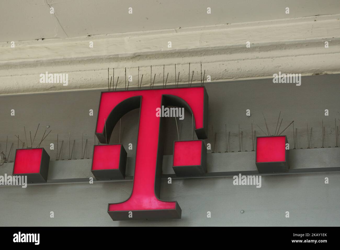 The logo of German telecommunications company Deutsche Telekom headquartered in Bonn and by revenue the largest telecommunications provider in Europe is seen in Munich. (Photo by Alexander Pohl/NurPhoto) Stock Photo