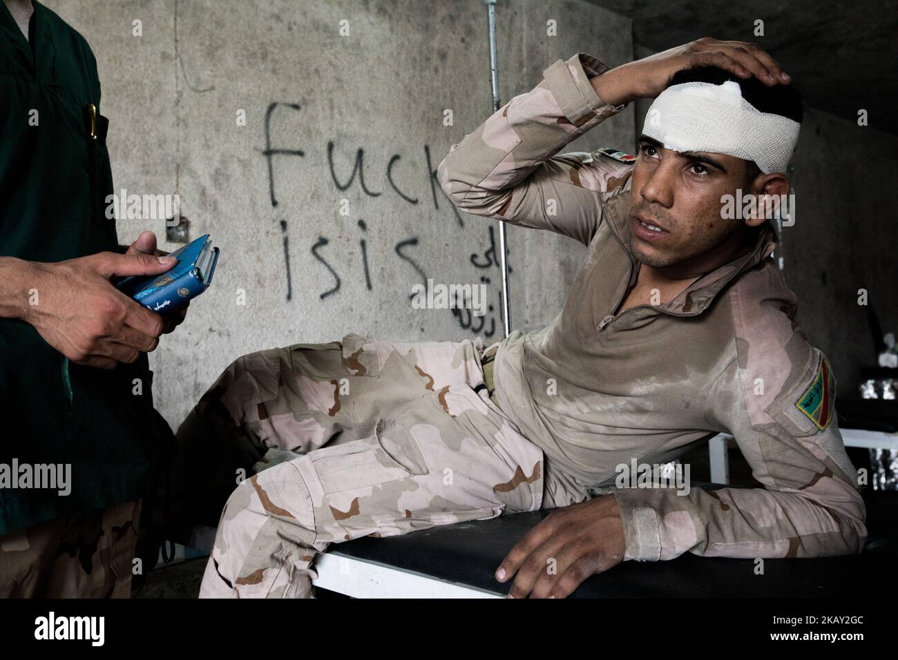 (7/3/2017) A soldier of the Iraqi army is treated in a field hospital in the western part of Mosul (Photo by Sebastian Backhaus/NurPhoto) Stock Photo