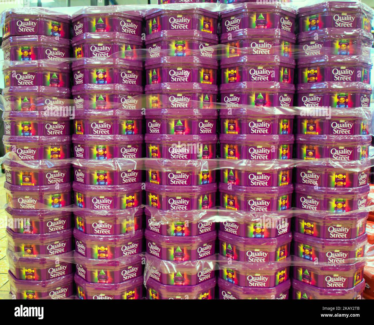 Rowntree quality street tins in supermarket piles Stock Photo