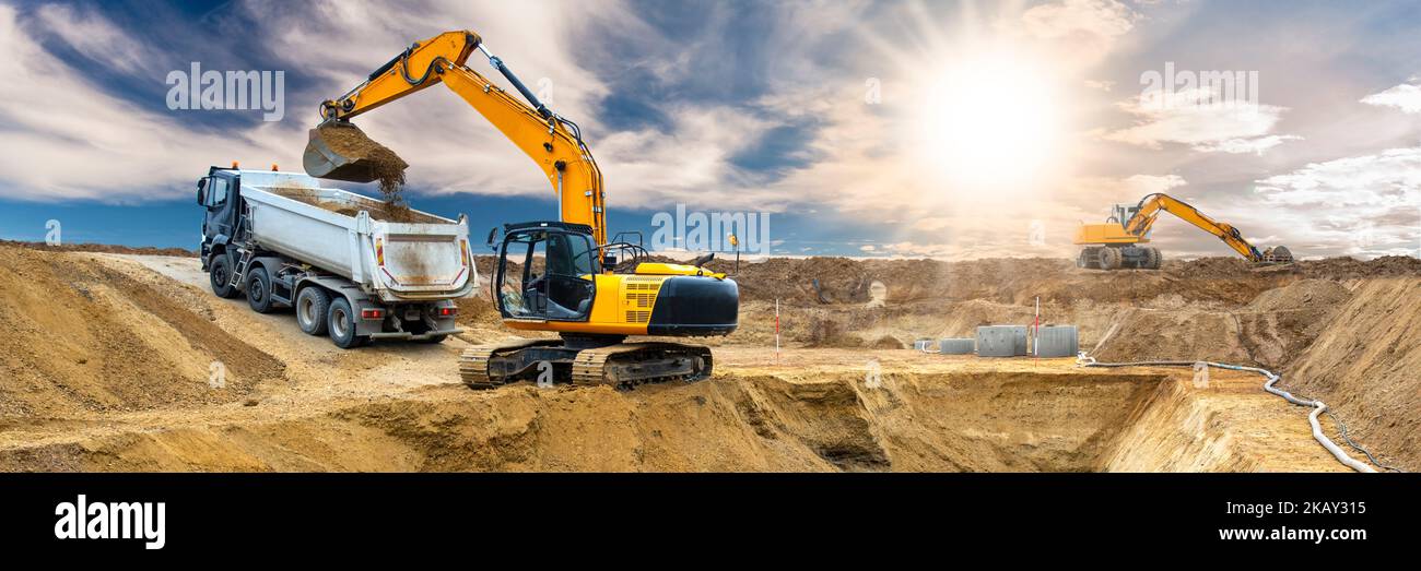 excavator is working and digging at construction site Stock Photo - Alamy