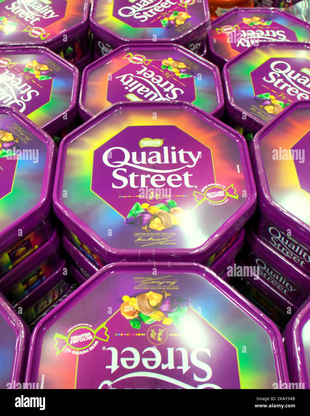 Rowntree quality street tins in supermarket piles Stock Photo