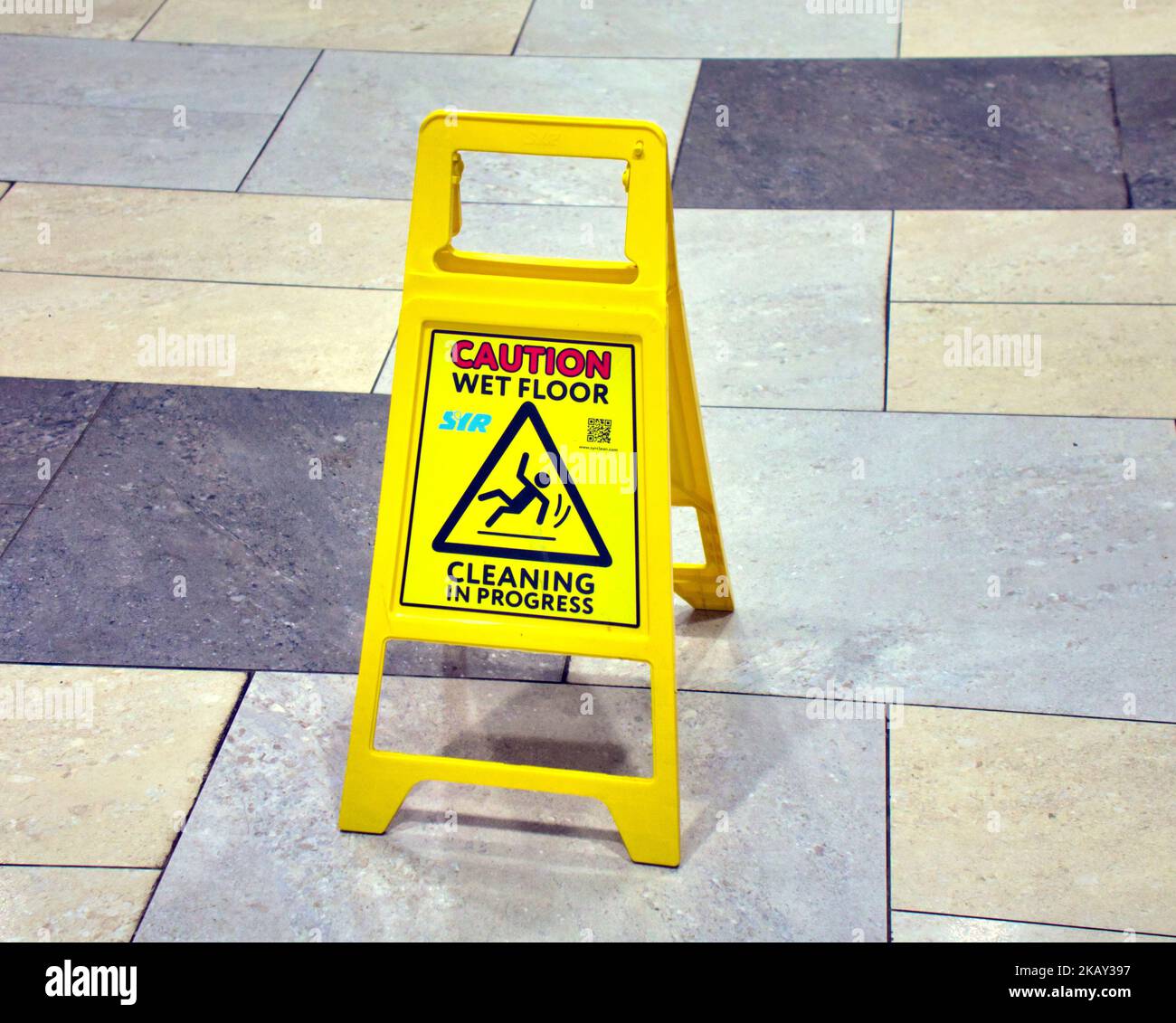 caution wet floor sign on marble floor Stock Photo