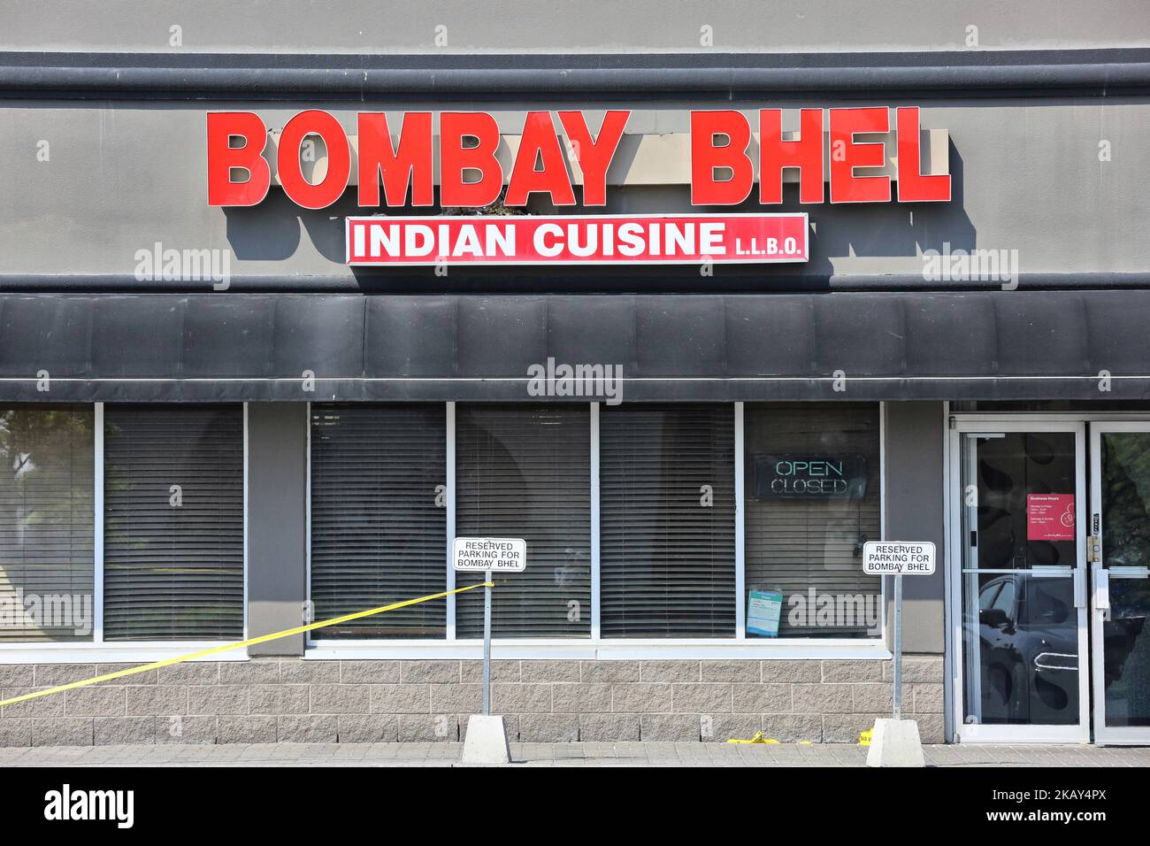 Police tape blocks off the at Bombay Bhel restaurant in Mississauga, Ontario, Canada, on May 27, 2018. 15 people were injured and 3 critically hurt after two men entered the Indian restaurant and detonated a homemade explosive device on Thursday May 25, 2018. The motive for the attack is still unknown and the police investigation is ongoing. (Photo by Creative Touch Imaging Ltd./NurPhoto) Stock Photo