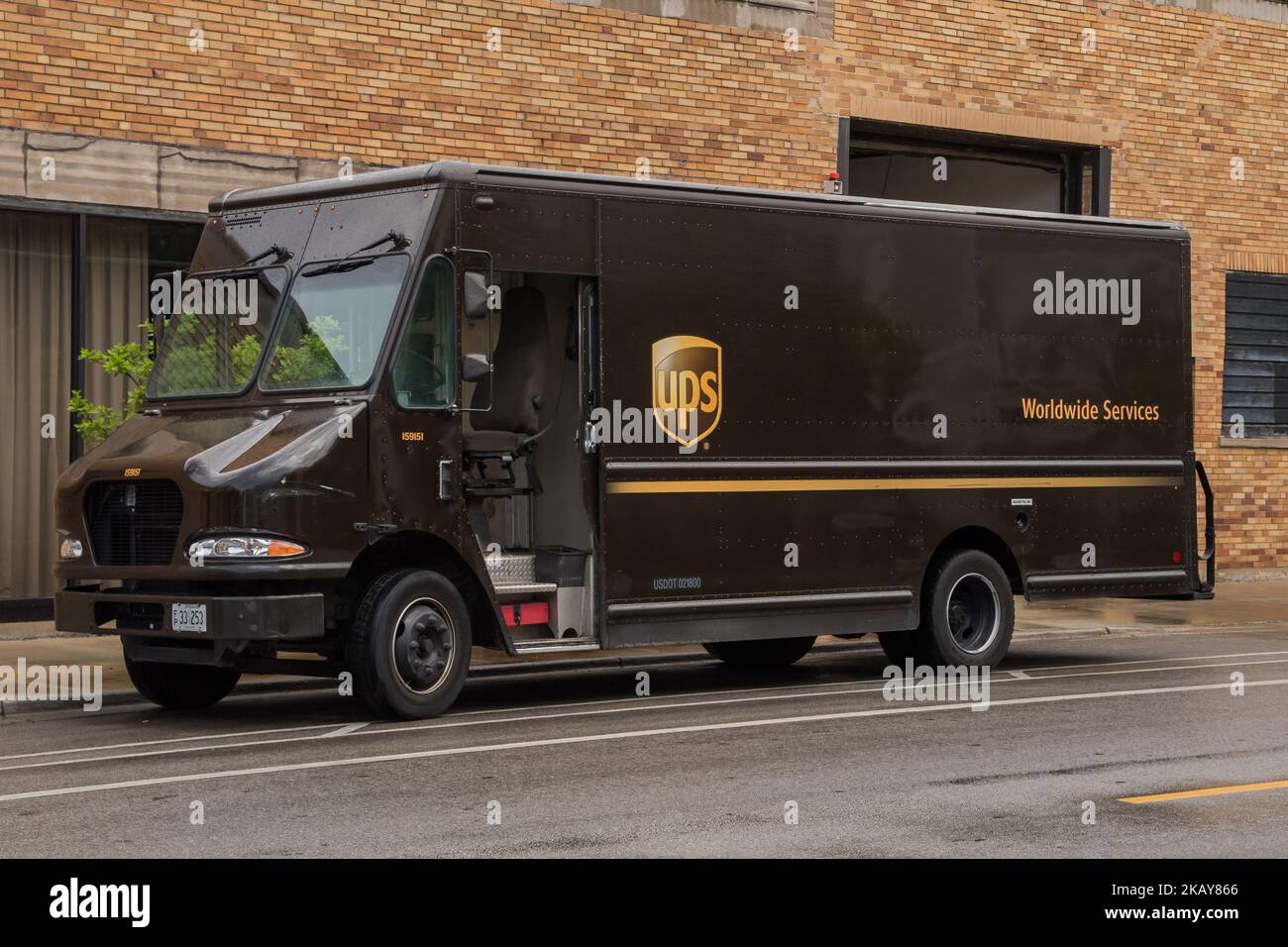 A United Parcel Service of America truck and drop-off box are seen along Milwaukee Avenue in the Old Irving Park neighborhood of Chicago, IL on June 6, 2018. The union announced that members voted more than 90% in favor of going on strike, if a deal is not reached before the current labor contract expires on August 1. UPS employs 260,000 Teamsters. The shipments UPS transports is an estimated 6% of the United States' GDP, which would disrupt the US economy if their is a walkout. UPS's previous strike was in 1997 for 16 days. (Photo by Patrick Gorski/NurPhoto) Stock Photo